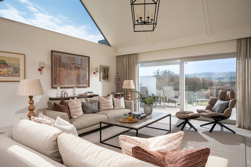 Sitting room with linen sofas on parquet-panel porcelain floor